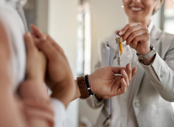 closeup-couple-receiving-keys-their-new-apartment-from-real-estate-agent_637285-6087