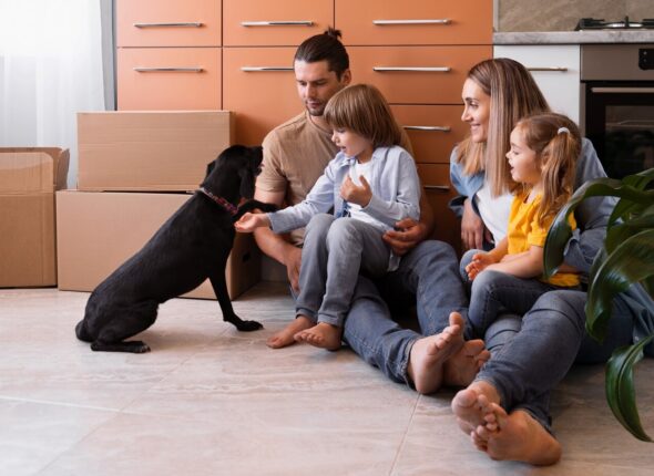 happy-family-with-dog-moving-new-home_23-2149749202