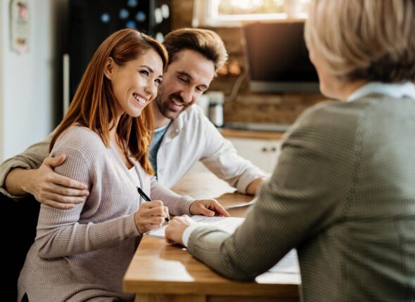 young-happy-woman-her-husband-signing-agreement-with-insurance-agent-meeting_637285-3078